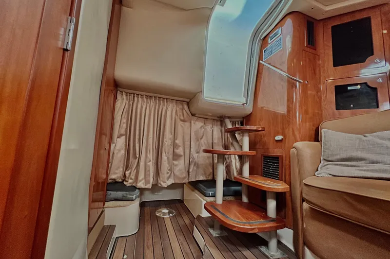 Slide: The Image of Interior of 2006 Four Winns 348 Vista yacht with wooden stairs and seating area. - 46