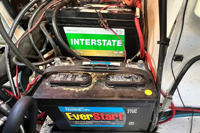 Slide: The Image of Marine batteries in a 2006 Four Winns 348 Vista boat engine compartment. - 49