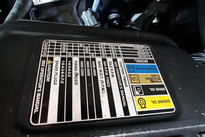 Slide: The Image of Engine specifications label on a 2006 Four Winns 348 Vista boat. - 54