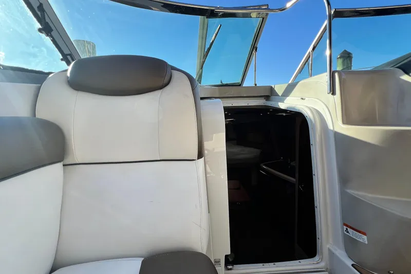Slide: The Image of 2006 Four Winns 348 Vista boat interior with open cabin door and seating. - 59