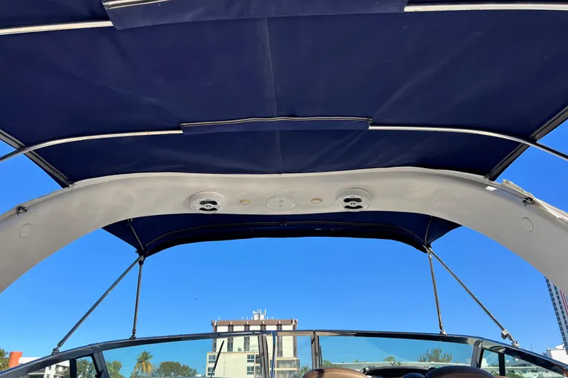 Slide: The Image of 2006 Four Winns 348 Vista boat canopy with clear blue sky background. - 72