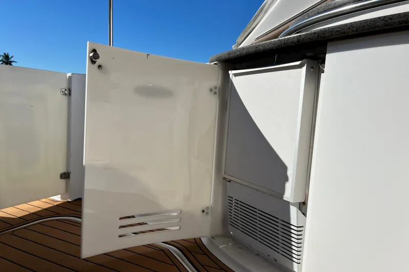 Slide: The Image of Open storage compartment on 2006 Four Winns 348 Vista boat, showcasing interior details. - 77