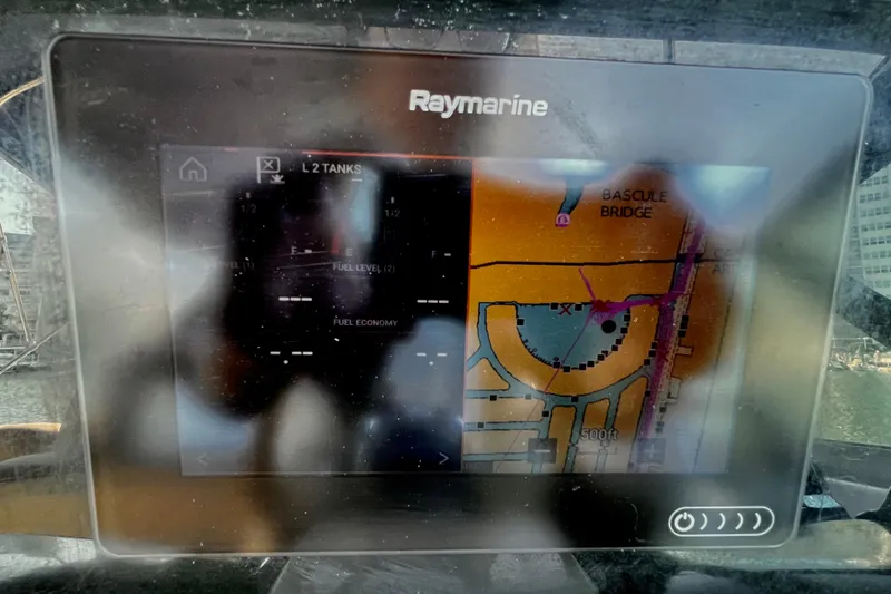 Slide: The Image of Raymarine navigation display on 2006 Four Winns 348 Vista, showing map and fuel levels. - 88