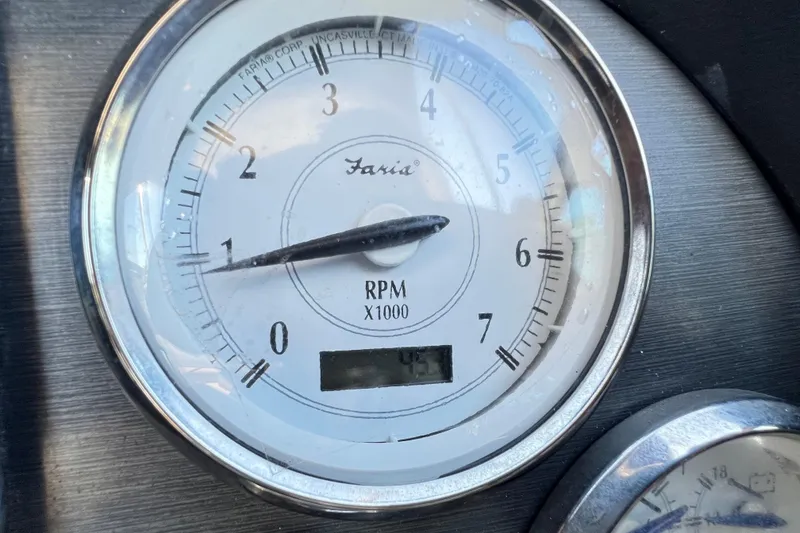 Slide: The Image of Close-up of a 2006 Four Winns 348 Vista tachometer displaying RPM readings. - 89