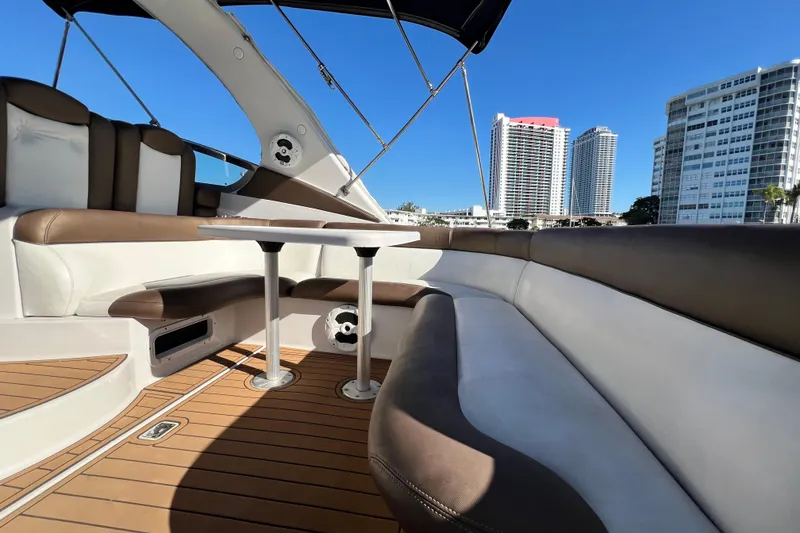 Slide: The Image of 2006 Four Winns 348 Vista boat interior with seating, table, and city skyline view. - 96