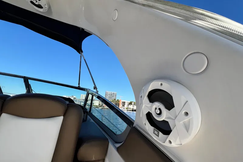 Slide: The Image of Interior view of a 2006 Four Winns 348 Vista boat with speaker and seating. - 98