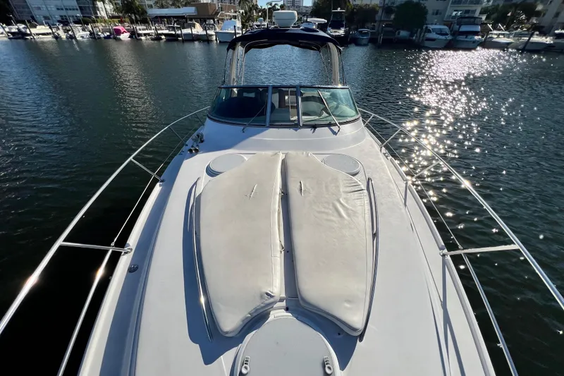 Slide: The Image of 2006 Four Winns 348 Vista yacht on water, sunlit deck, marina background. - 99