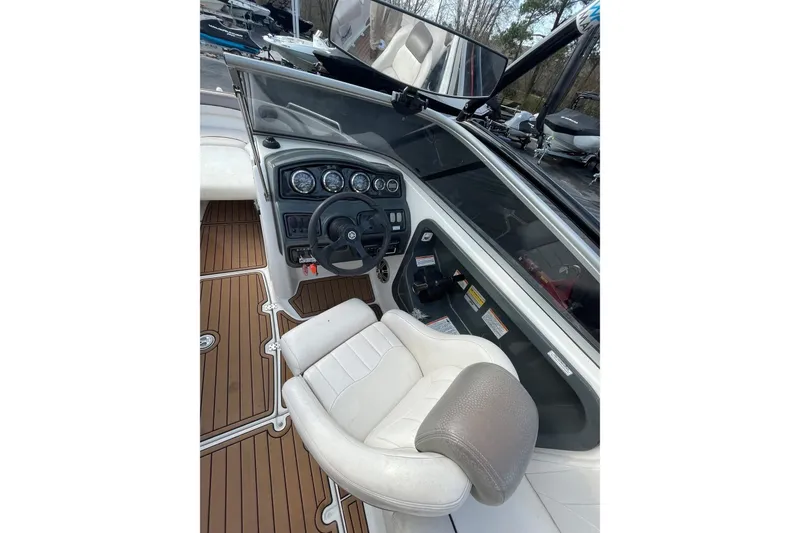 Slide: The Image of 2007 Yamaha Boats AR230 HO cockpit with steering wheel and dashboard controls. - 10
