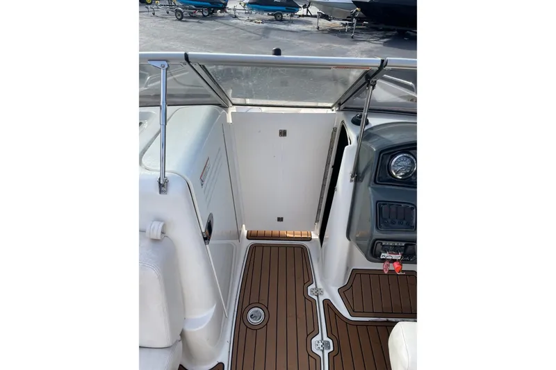 Slide: The Image of 2007 Yamaha Boats AR230 HO interior with wood-style flooring and control panel. - 4