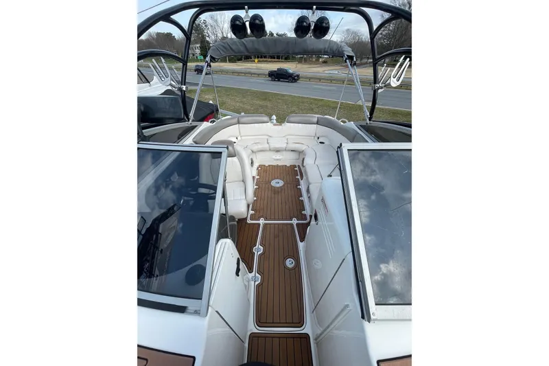 Slide: The Image of 2007 Yamaha Boats AR230 HO interior with sleek seating and wood-style flooring. - 7