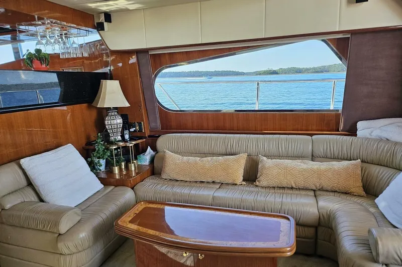 Slide: The Image of Luxurious 2003 Johnson FLY yacht interior with leather seating and ocean view. - 14