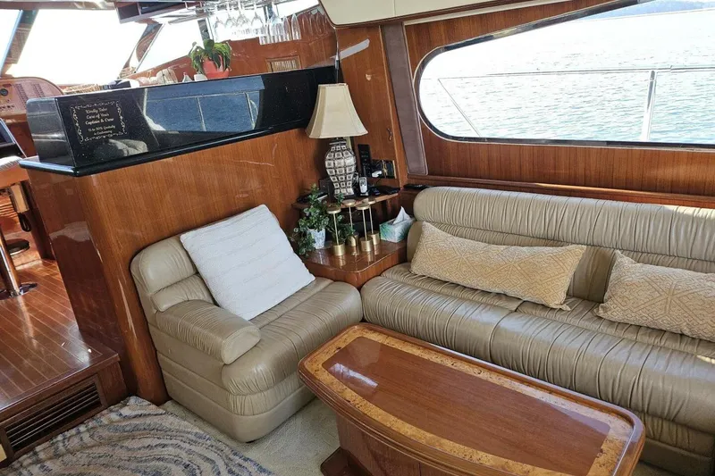 Slide: The Image of Luxurious 2003 Johnson FLY yacht interior with leather seating and elegant wood finishes. - 17