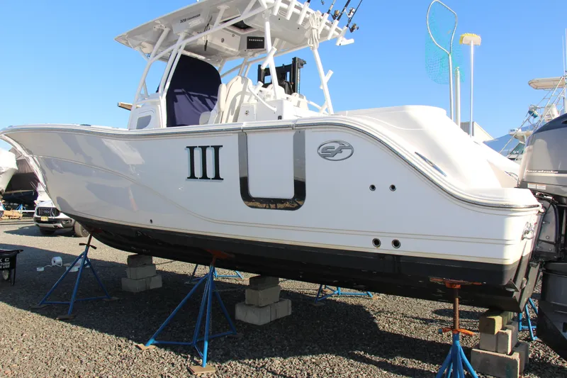 Slide: The Image of 2020 Sea Fox 328 Commander boat on stands, displayed outdoors. - 6