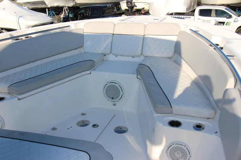 Slide: The Image of 2020 Sea Fox 328 Commander boat interior with cushioned seating and speakers. - 7