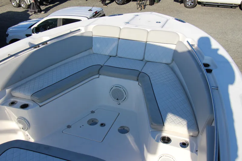 Slide: The Image of 2020 Sea Fox 328 Commander boat interior with cushioned seating and cup holders. - 9