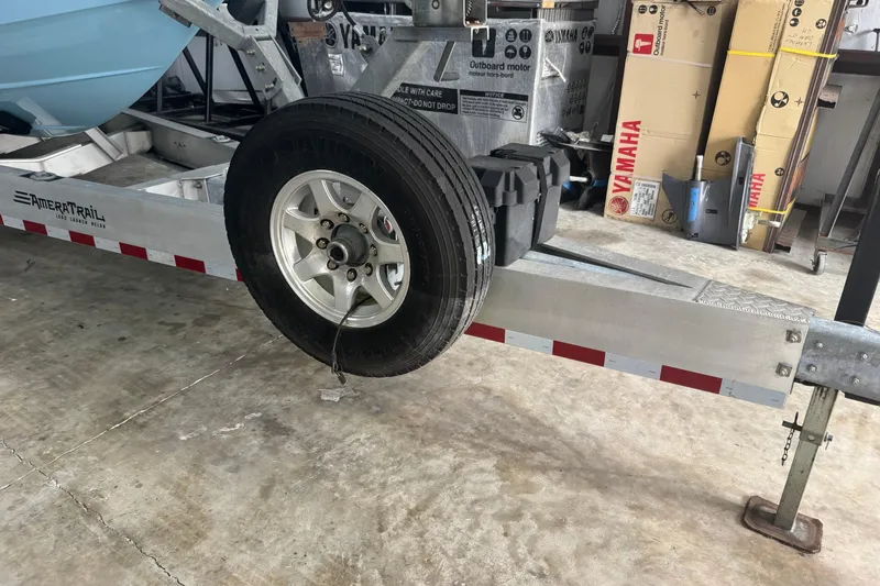 Slide: The Image of Trailer with spare tire for 2019 Fountain 38 Center Console boat. - 15