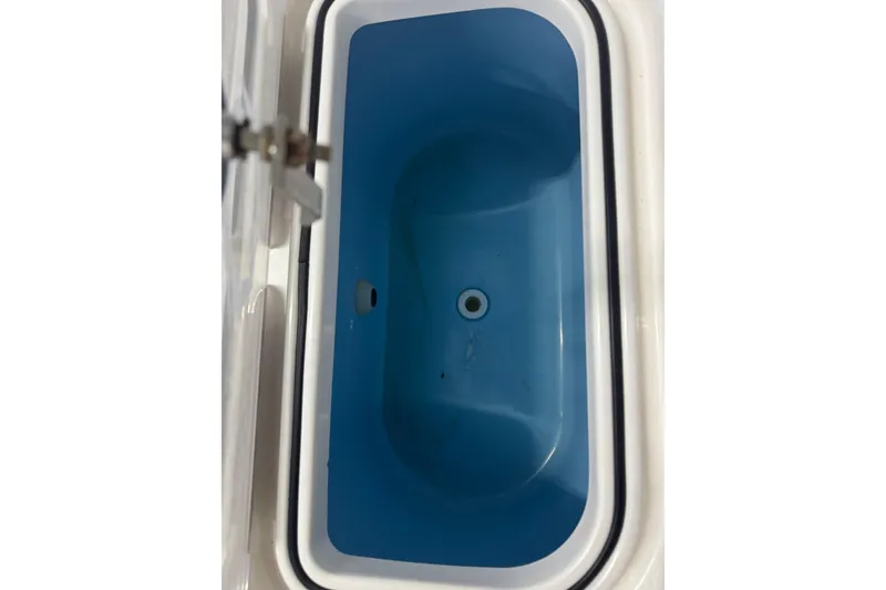 Slide: The Image of 2019 Fountain 38 Center Console livewell, blue interior, white trim. - 18