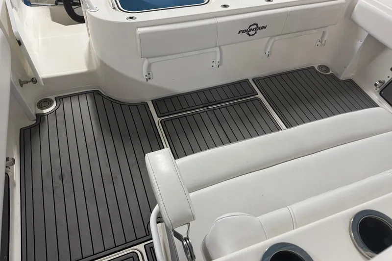 Slide: The Image of 2019 Fountain 38 Center Console boat interior with sleek seating and non-slip flooring. - 25