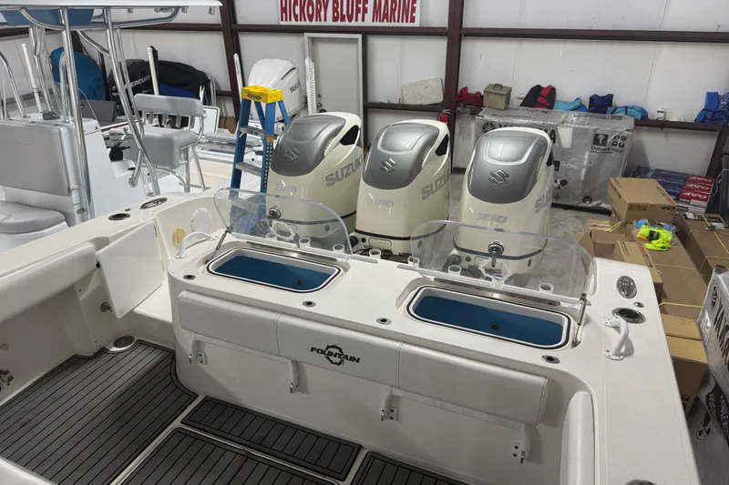 Slide: The Image of 2019 Fountain 38 Center Console boat with Suzuki engines in a marine workshop. - 28