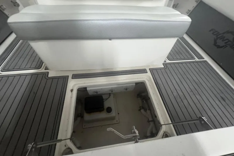 Slide: The Image of 2019 Fountain 38 Center Console boat interior with open storage compartment. - 42