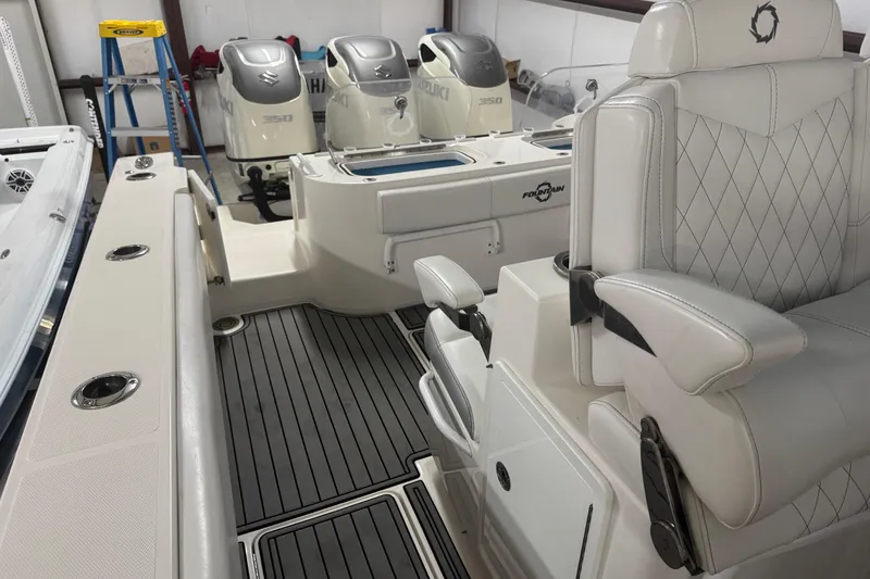 Slide: The Image of 2019 Fountain 38 Center Console boat interior with luxurious seating and powerful engines. - 48