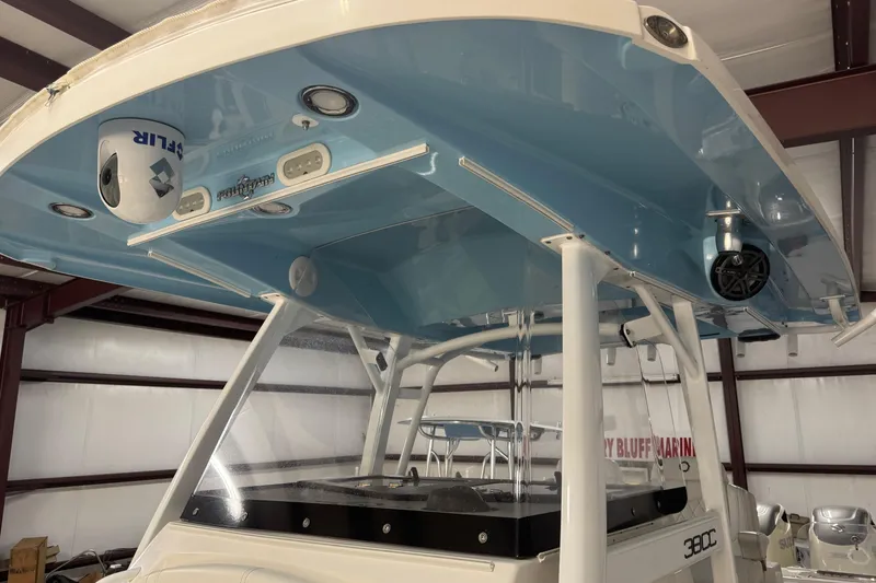 Slide: The Image of 2019 Fountain 38 Center Console boat with blue T-top and advanced electronics. - 51