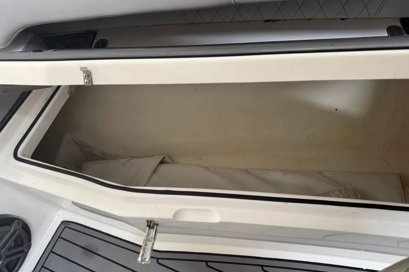 Slide: The Image of Open storage compartment on a 2019 Fountain 38 Center Console boat. - 57