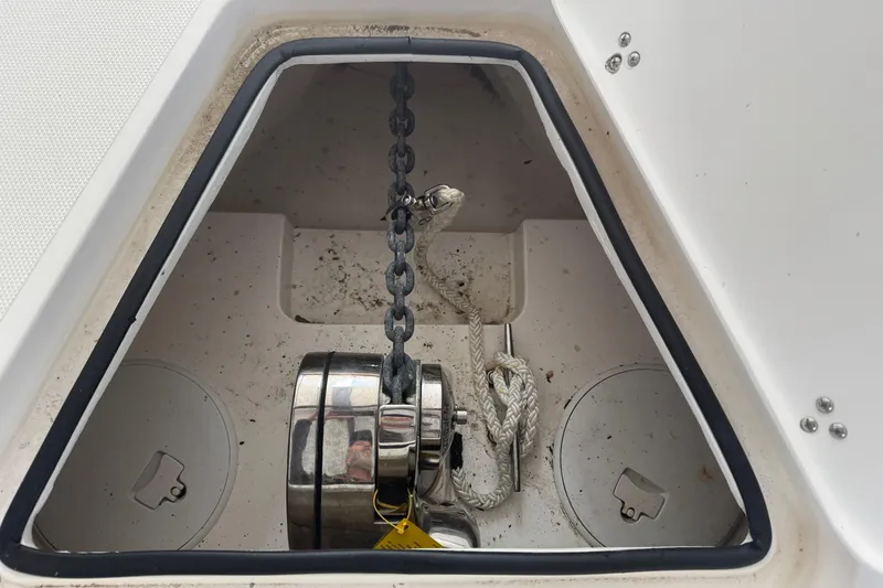Slide: The Image of Anchor compartment of 2019 Fountain 38 Center Console boat with chain and rope. - 61