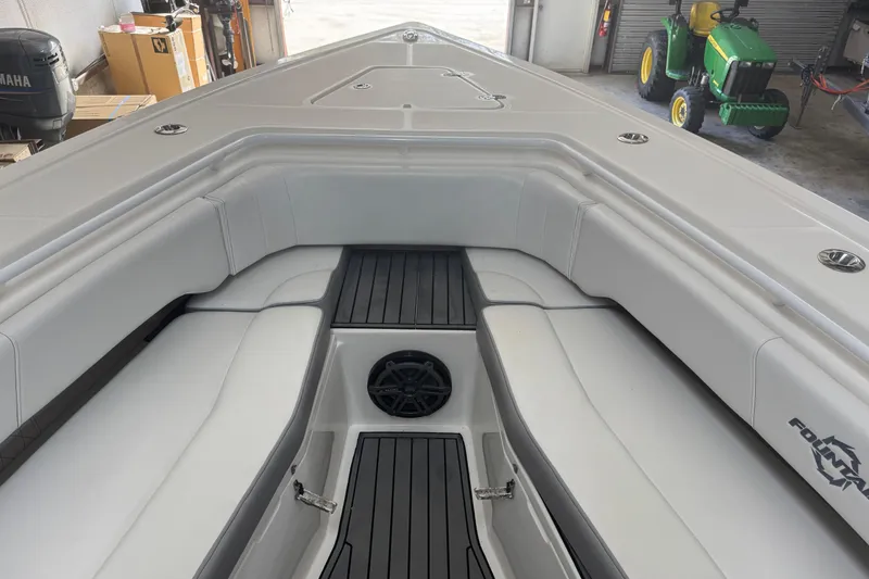 Slide: The Image of 2019 Fountain 38 Center Console boat interior with white seating and speaker. - 8