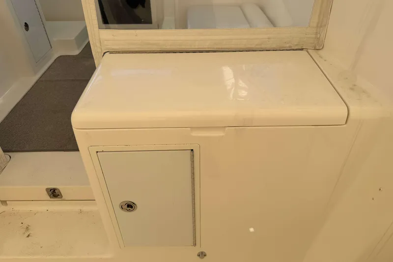 Slide: The Image of 2008 Henriques 30 Express interior detail with storage compartment and seating area. - 22