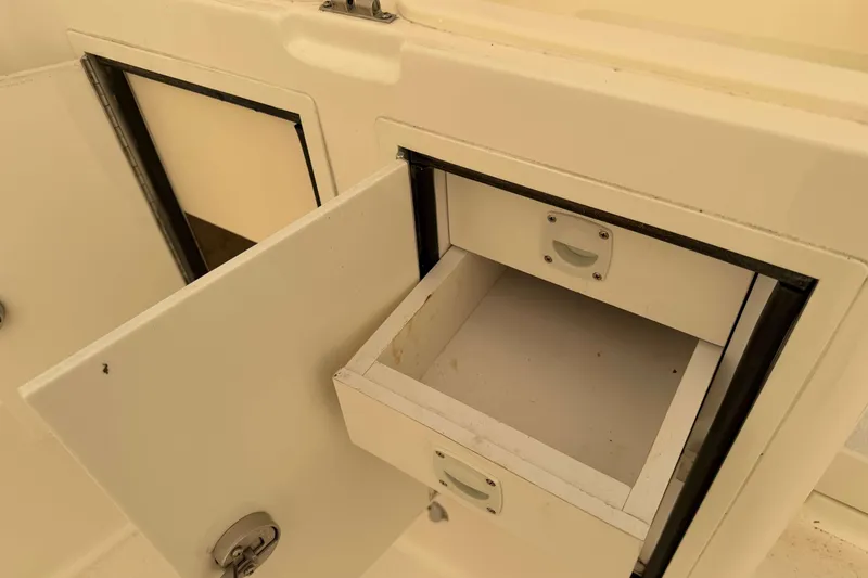Slide: The Image of Open storage compartment on 2008 Henriques 30 Express boat, showcasing interior space. - 29