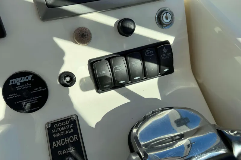 Slide: The Image of 2008 Henriques 30 Express boat control panel with switches and Fireboy system. - 41
