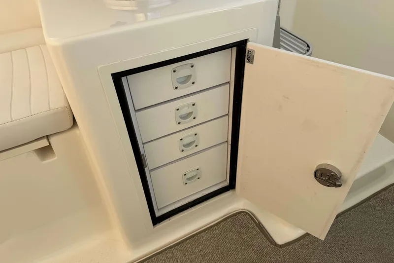 Slide: The Image of Storage compartment with drawers on a 2008 Henriques 30 Express boat. - 45