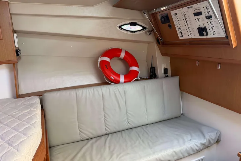 Slide: The Image of 2008 Henriques 30 Express cabin interior with seating, life preserver, and control panel. - 51
