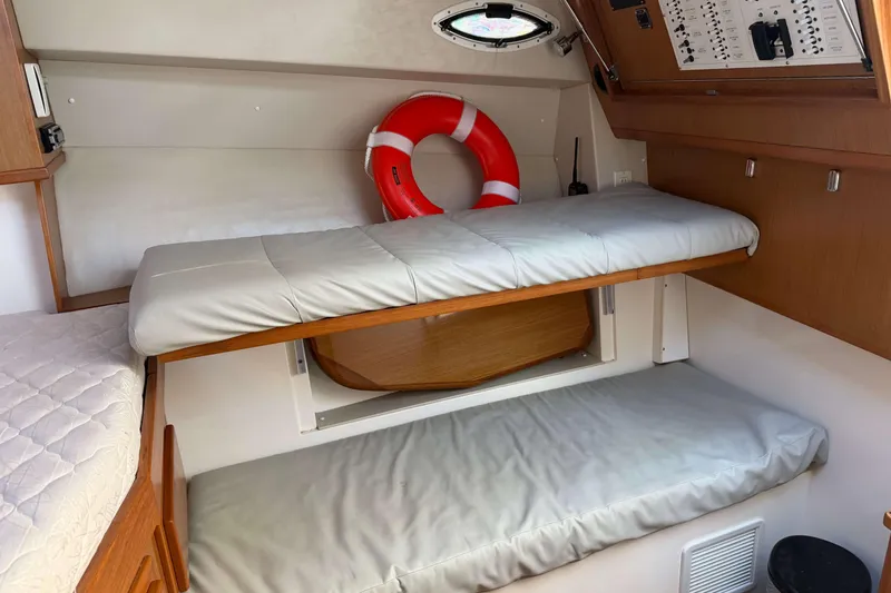 Slide: The Image of 2008 Henriques 30 Express cabin interior with bunk beds and life preserver. - 52