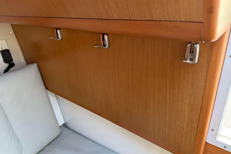 Slide: The Image of Interior of 2008 Henriques 30 Express boat with wooden panel and hooks. - 55