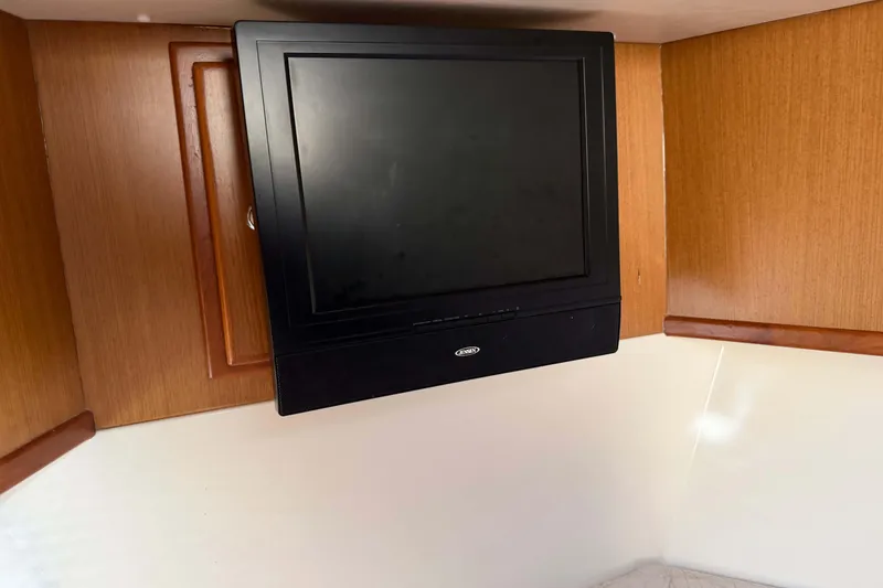 Slide: The Image of Wall-mounted TV in 2008 Henriques 30 Express boat interior. - 65