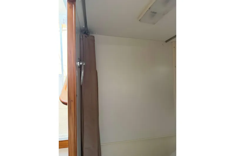 Slide: The Image of Interior view of 2008 Henriques 30 Express boat with curtain and wooden trim. - 70