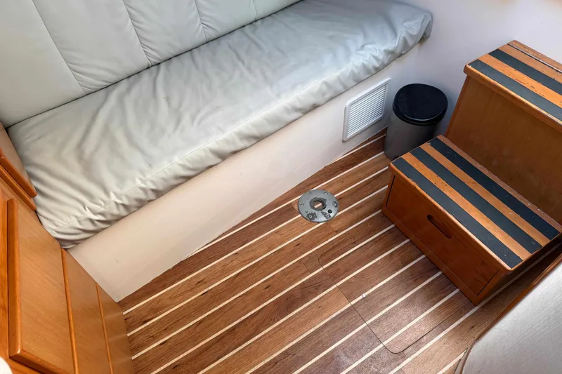 Slide: The Image of 2008 Henriques 30 Express cabin interior with wooden flooring and cushioned seating. - 72
