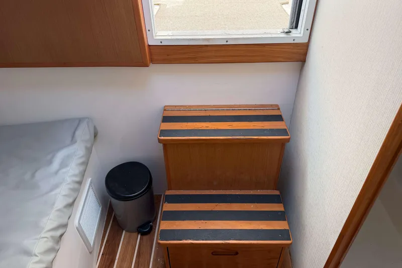 Slide: The Image of Interior of 2008 Henriques 30 Express boat with wooden steps and compact design. - 75