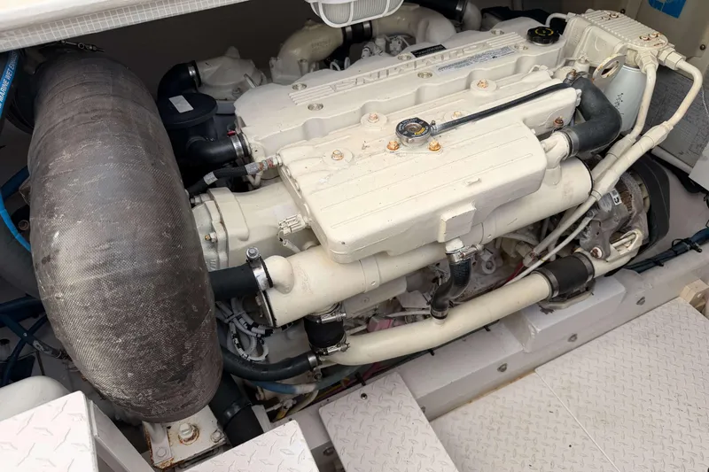 Slide: The Image of Engine compartment of a 2008 Henriques 30 Express boat, showcasing detailed machinery. - 78