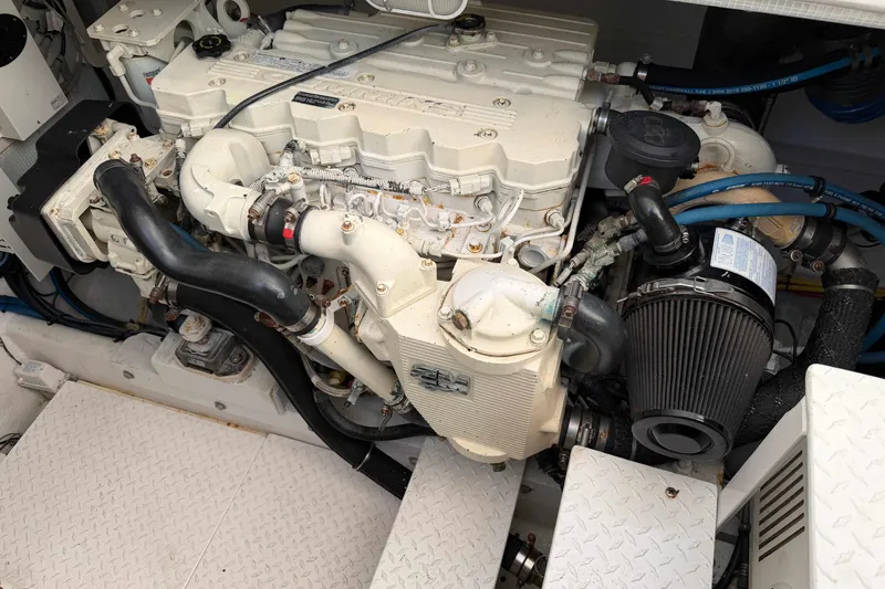 Slide: The Image of Engine compartment of a 2008 Henriques 30 Express boat, showcasing detailed components. - 79