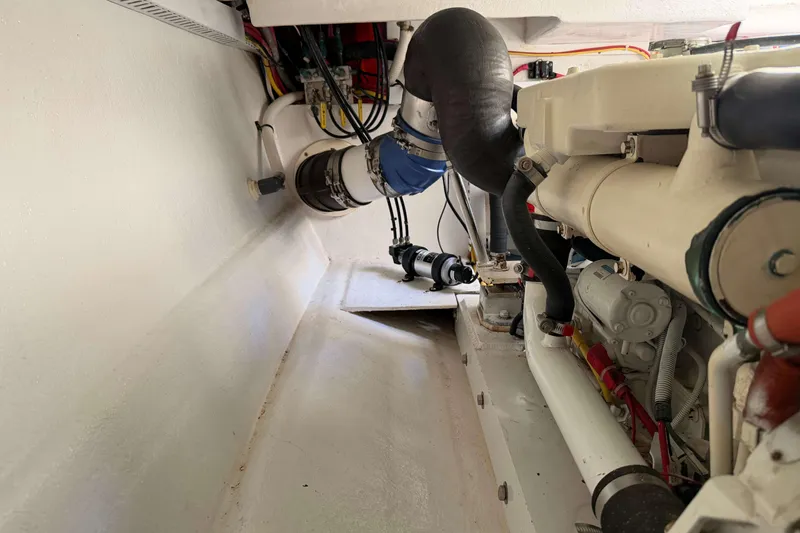 Slide: The Image of Engine room of 2008 Henriques 30 Express boat, showcasing mechanical components and wiring. - 82