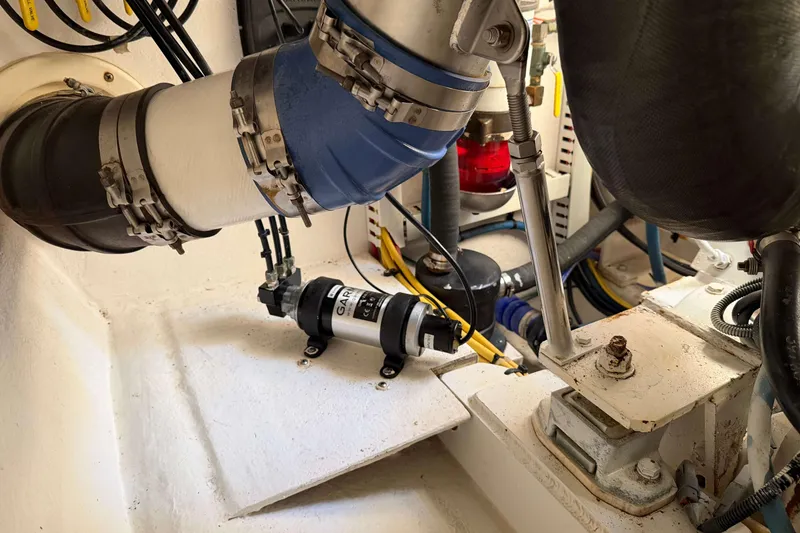 Slide: The Image of Engine room of 2008 Henriques 30 Express boat with visible mechanical components. - 83