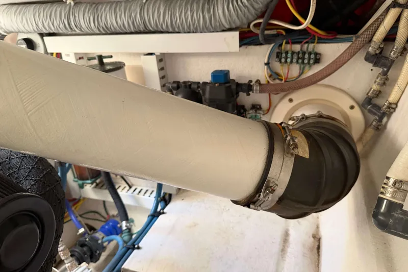 Slide: The Image of Engine room of 2008 Henriques 30 Express boat showing exhaust and wiring. - 88