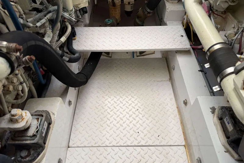 Slide: The Image of Engine compartment of a 2008 Henriques 30 Express boat, showing mechanical components. - 90