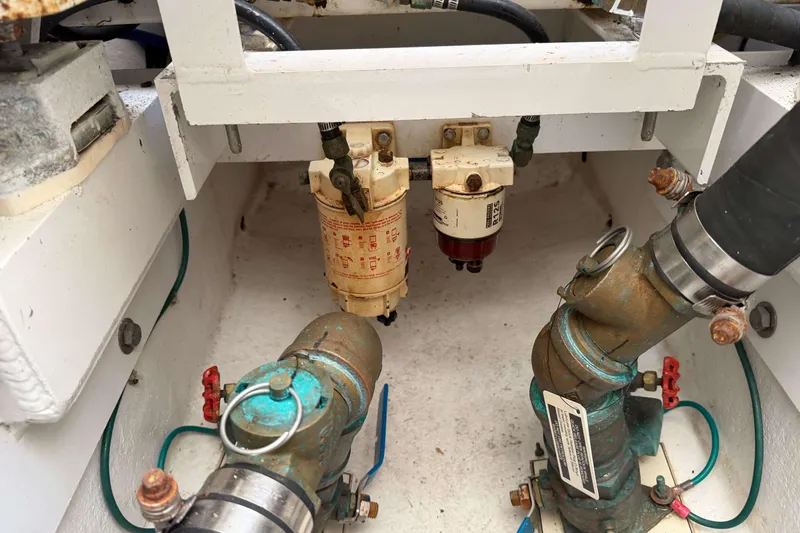 Slide: The Image of Engine compartment of 2008 Henriques 30 Express, showcasing fuel filters and plumbing components. - 91