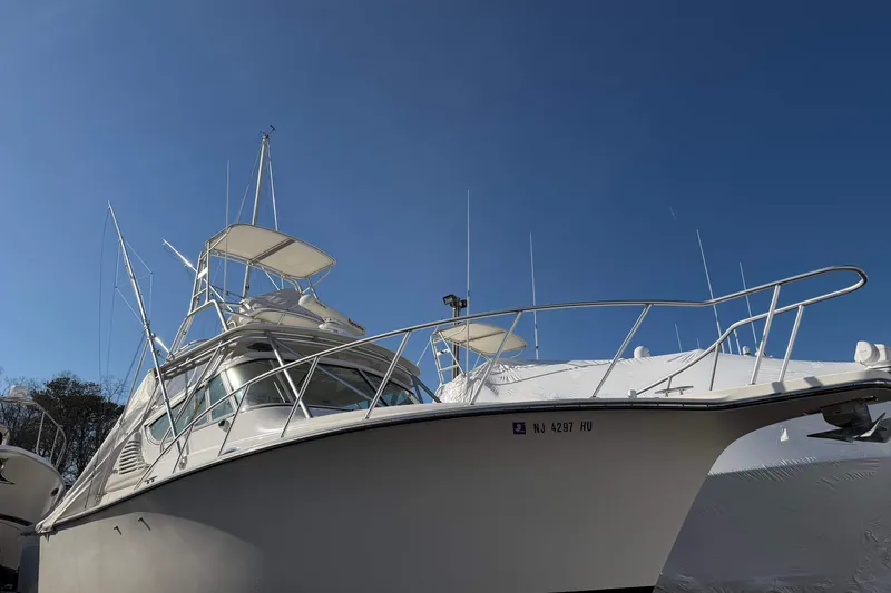 Slide: The Image of 2008 Henriques 30 Express boat under clear blue sky. - 98