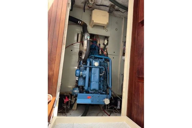 Slide: The Image of Roughwater MOTOR SAILER 1980 with coiled rope on deck, showcasing nautical details. - 18