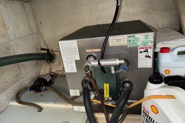 Slide: The Image of Battery charger installed on 1980 Roughwater MOTOR SAILER, featuring ProNautic 1230P model. - 21